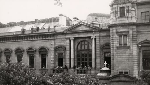 A crowd watches the Union flag