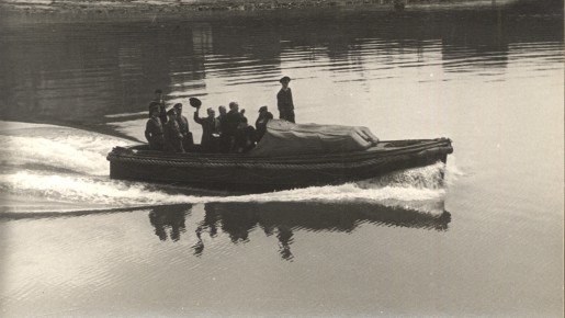a group of men in a small boat