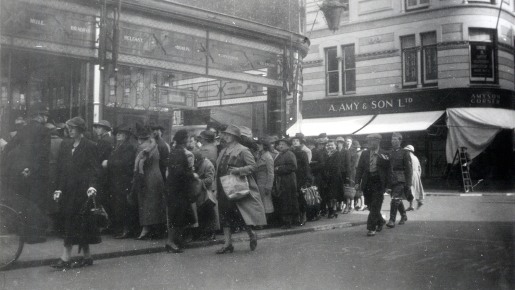 People stand in a queue in 1940