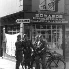 A group of German soldiers photographed outside a shop