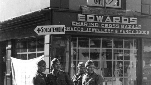 A group of German soldiers photographed outside a shop
