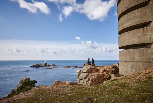 Two people sitting on the headland