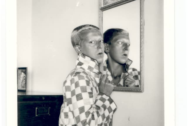 women_in_mirror_checked_coat