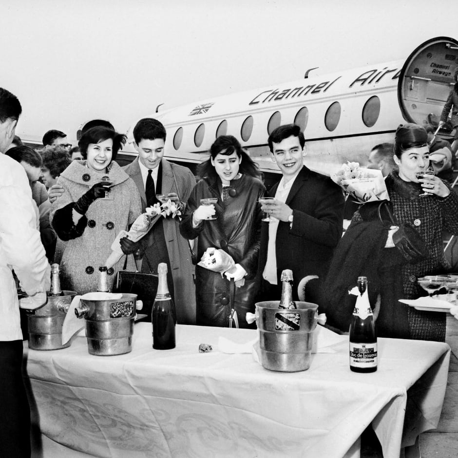 Couples drink champagne on arrival at the airport