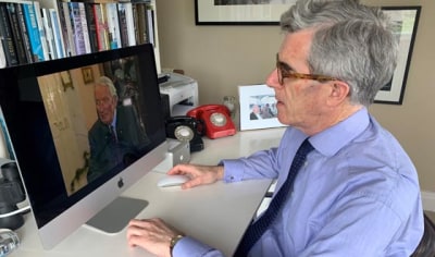Man watches a TV screen