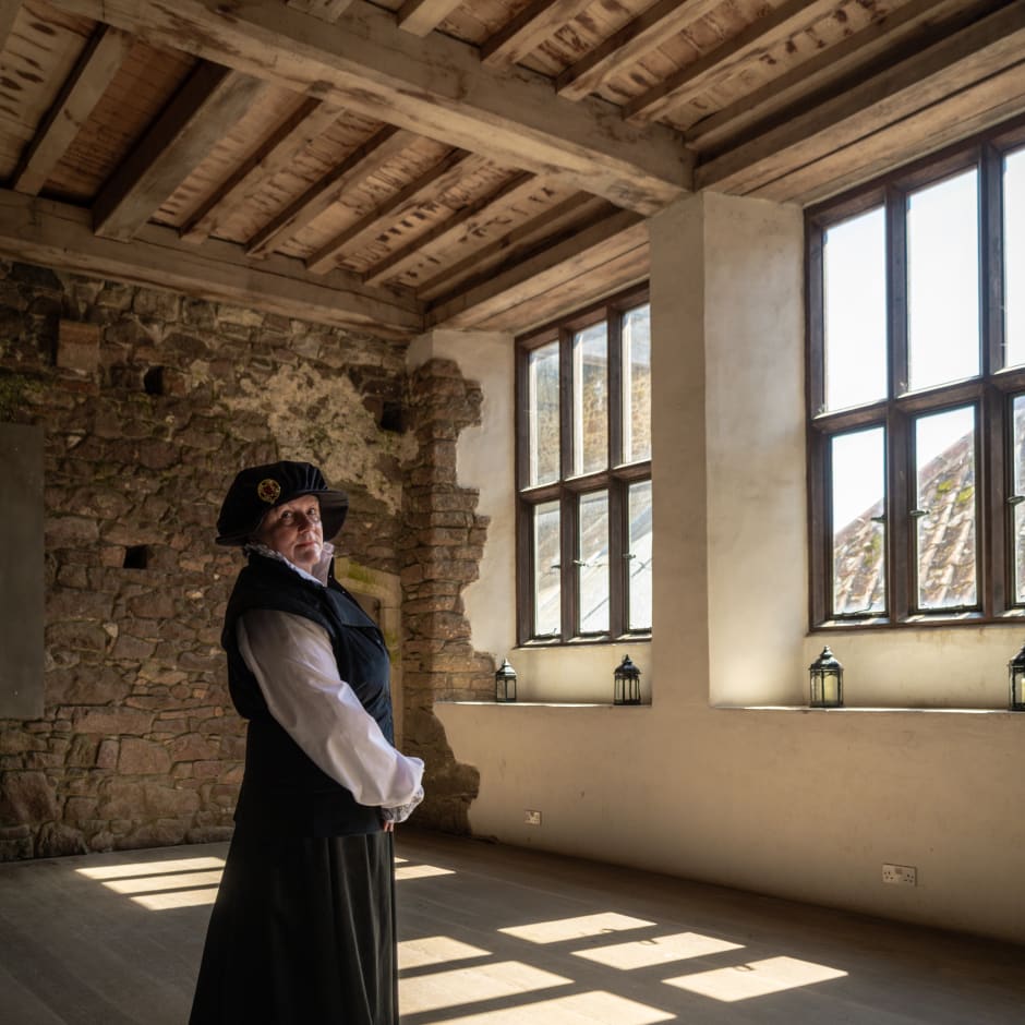 Nobel women stands in large windowed area
