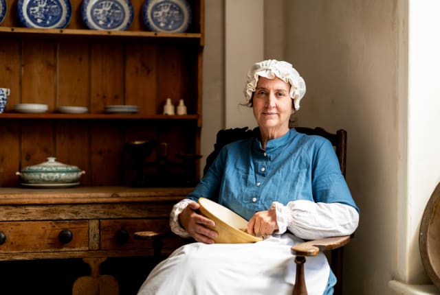 Person dressed as a kitchen maid