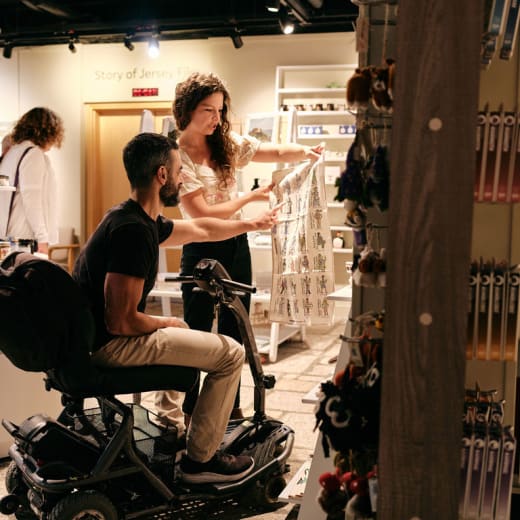 Couple look at a shop rack