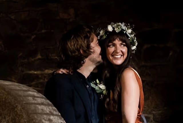 bride and groom kiss
