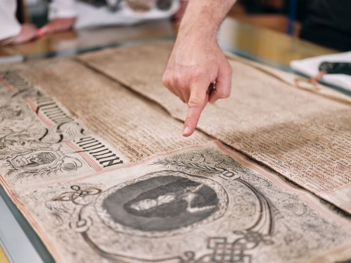 Jersey Archive finger points to important docuement
