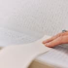 Jersey Archive fingers on old written book