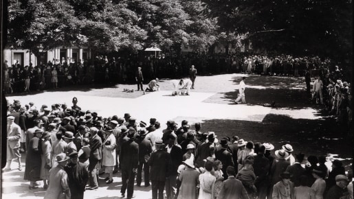 Crowd around a public square.
