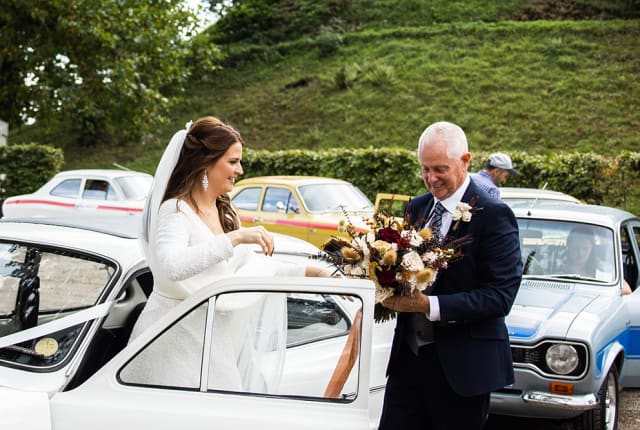 bride arrives in classic car