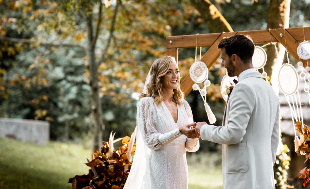 La Hougue Bie Bride and Groom hold hands at alter