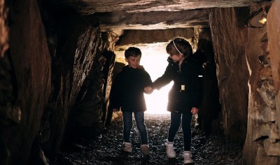 La Hougue Bie young children enter dolmen