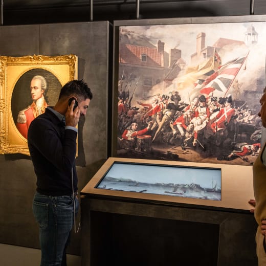 people listen to some audio as part of an exhibition