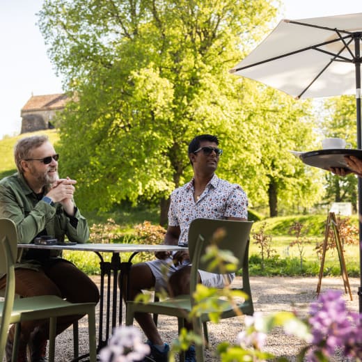 People get served a coffee outside