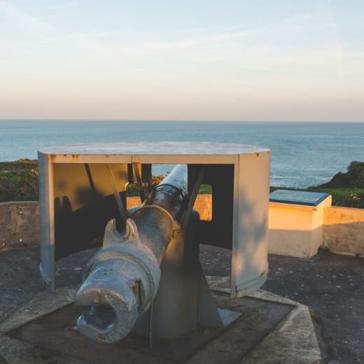 A large miliary gun on a bunker