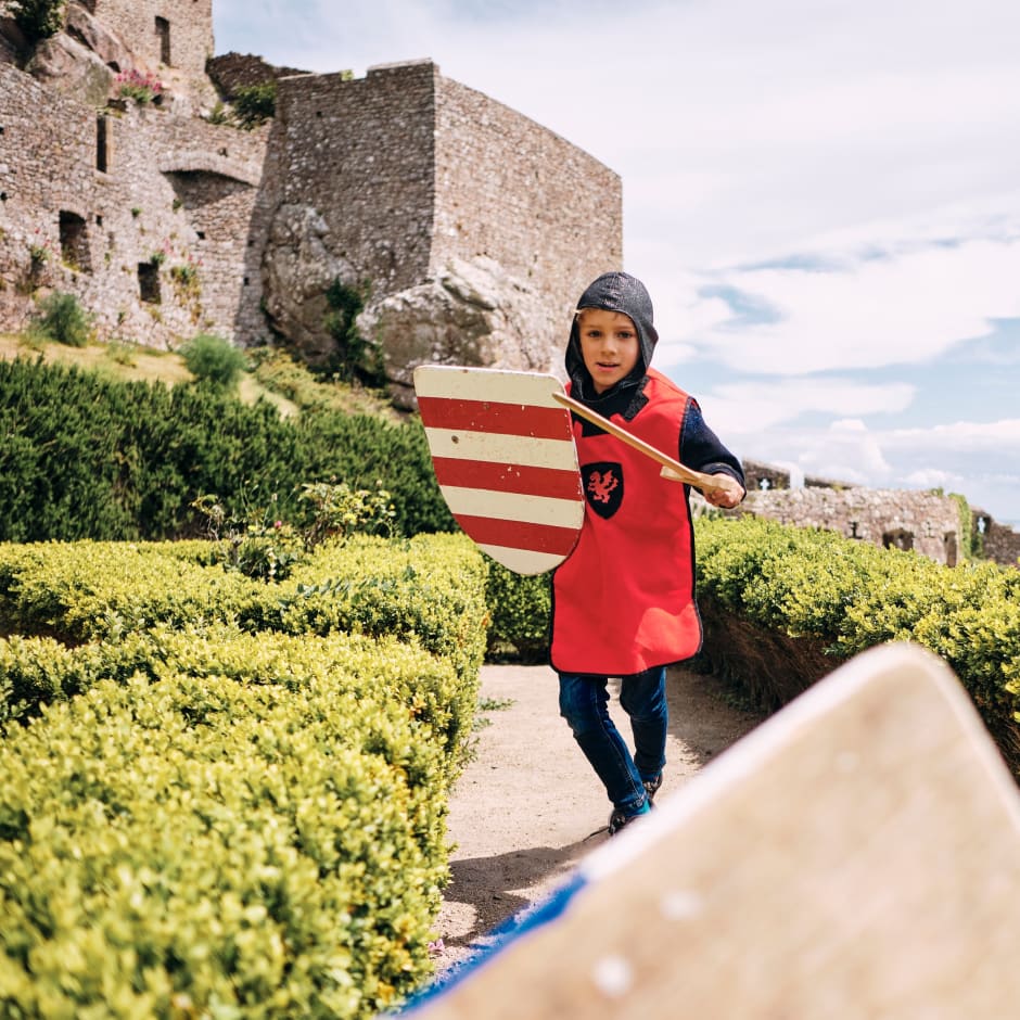Mont Orgueil Castle young boy in kinghts costume