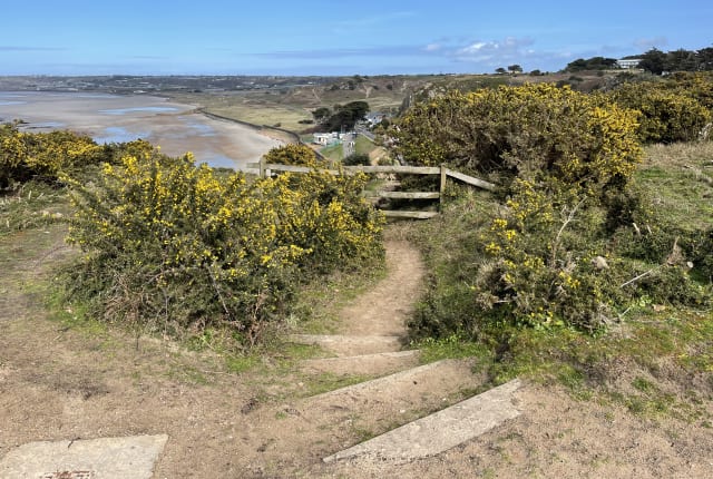 Steps lead to La Pulente beach front.