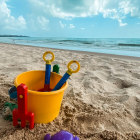 A bucket and spade on a beach