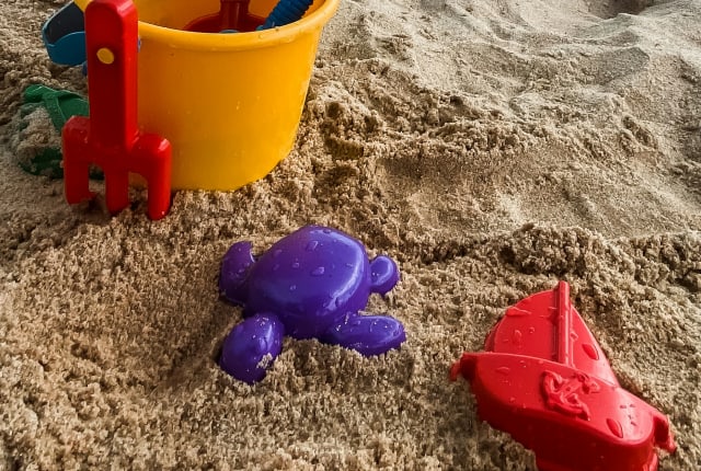 A bucket and spade on a beach