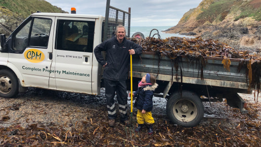 Collecting seaweed in a white van