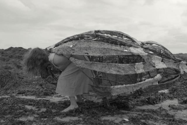 Woman with shell artwork on her back