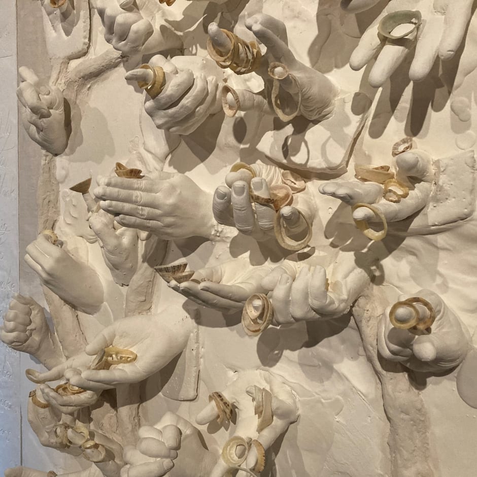 Hands coming out of a plaster cast artwork